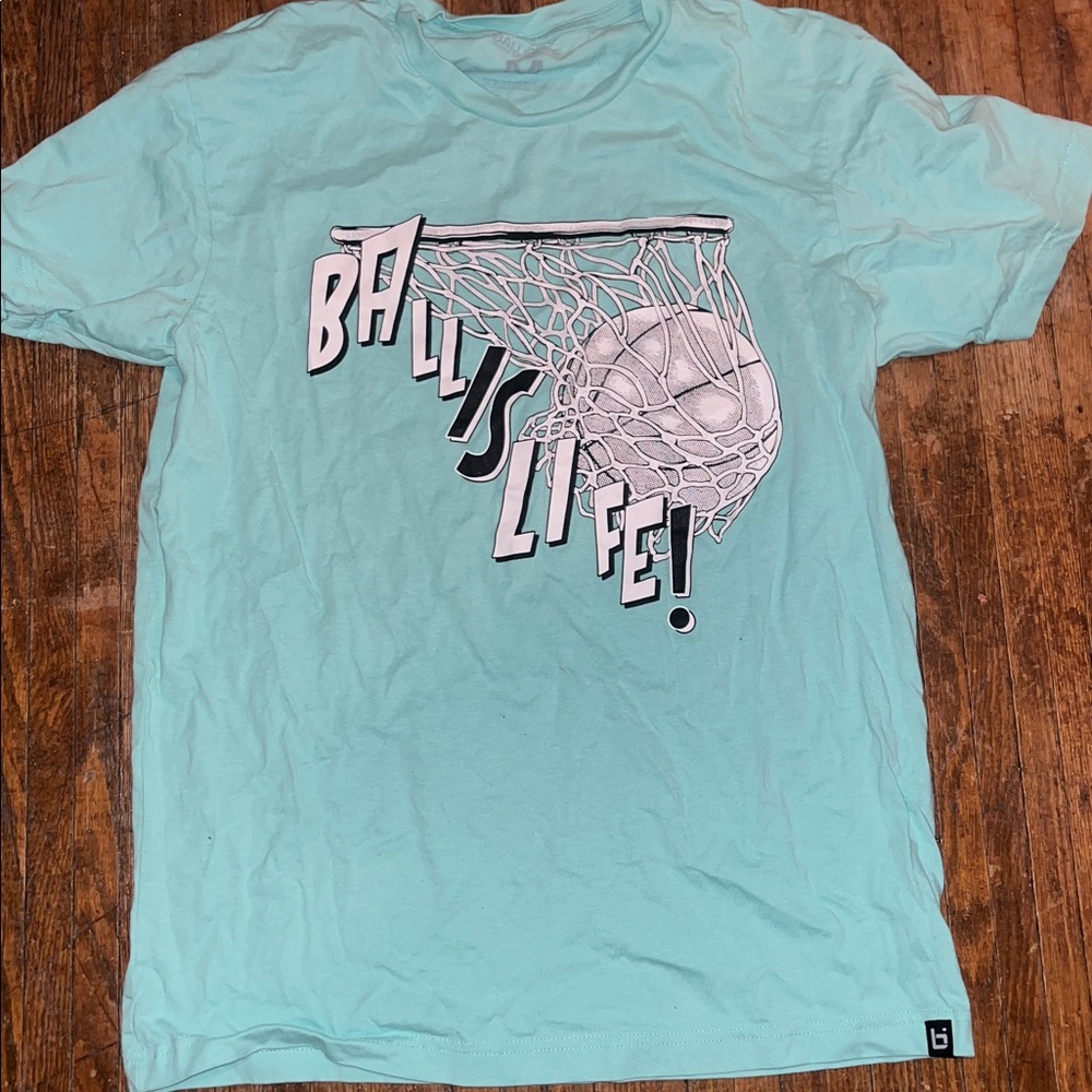 3/$15. Men’s tee M